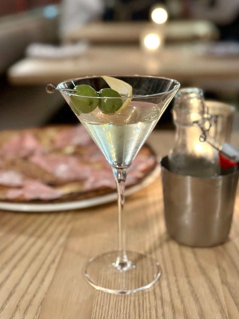 Olive Leaf Martini at the recently opened Corzetti (with the spectacular focaccia di Recco with mortadella in the background