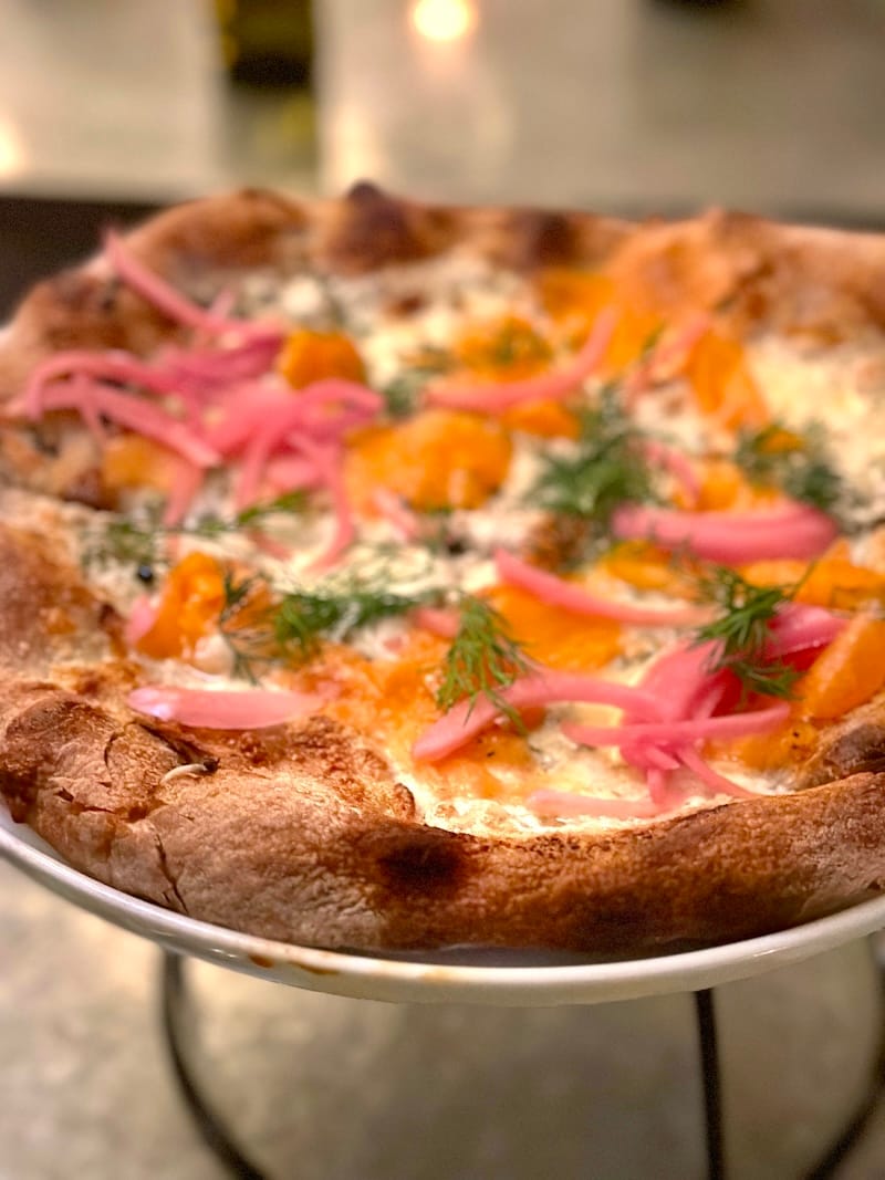 Gravlax Pie on Delfina’s Hanukkah menu, with house-cured salmon, pickled onions, capers, mascarpone, dill, and a buckwheat crust