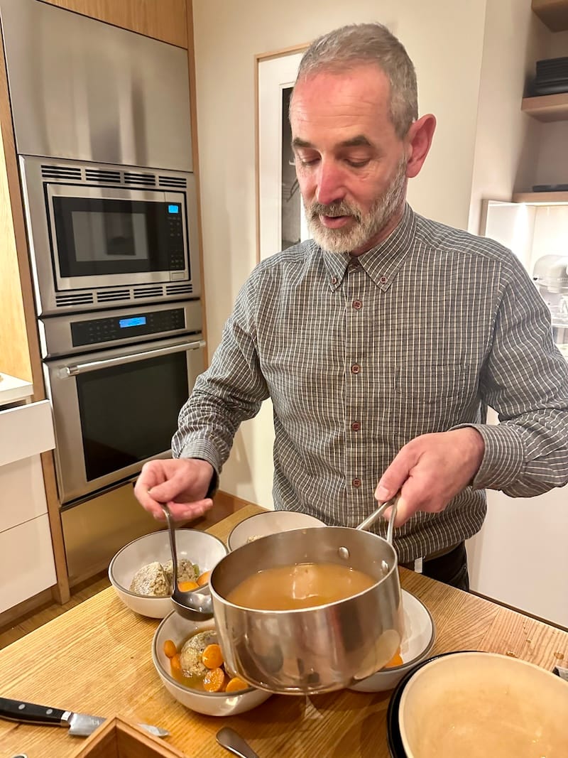 My friend Arkay serving the matzo ball soup. 