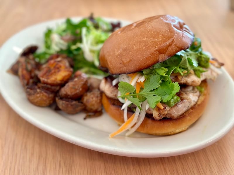 The flattop-grilled lemongrass chicken sandwich with Thai green curry. Photo: © tablehopper.com.
