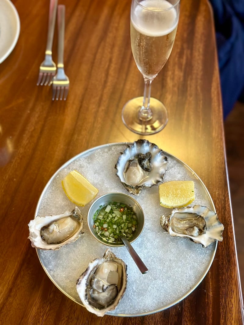 Happy hour oysters and an $8 glass of Gloria Ferrer brut. Photo: © tablehopper.com.