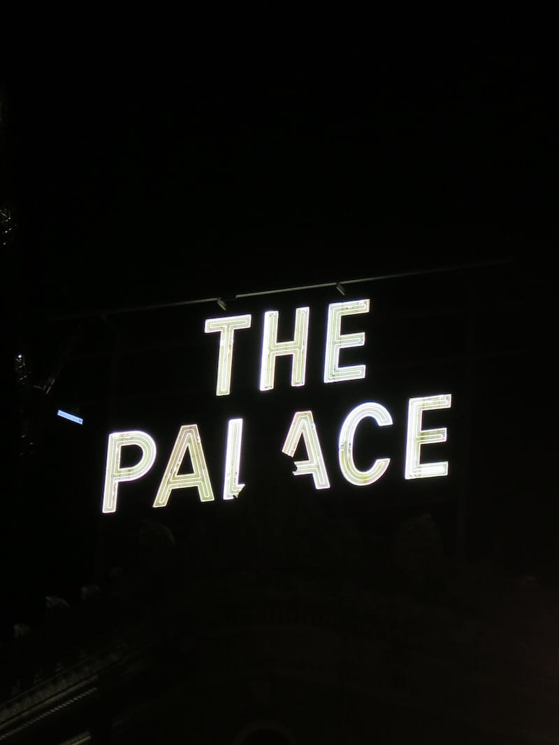 A night photo of one of The Palace rooftop neon signs (2016). Photo: © tablehopper.com.