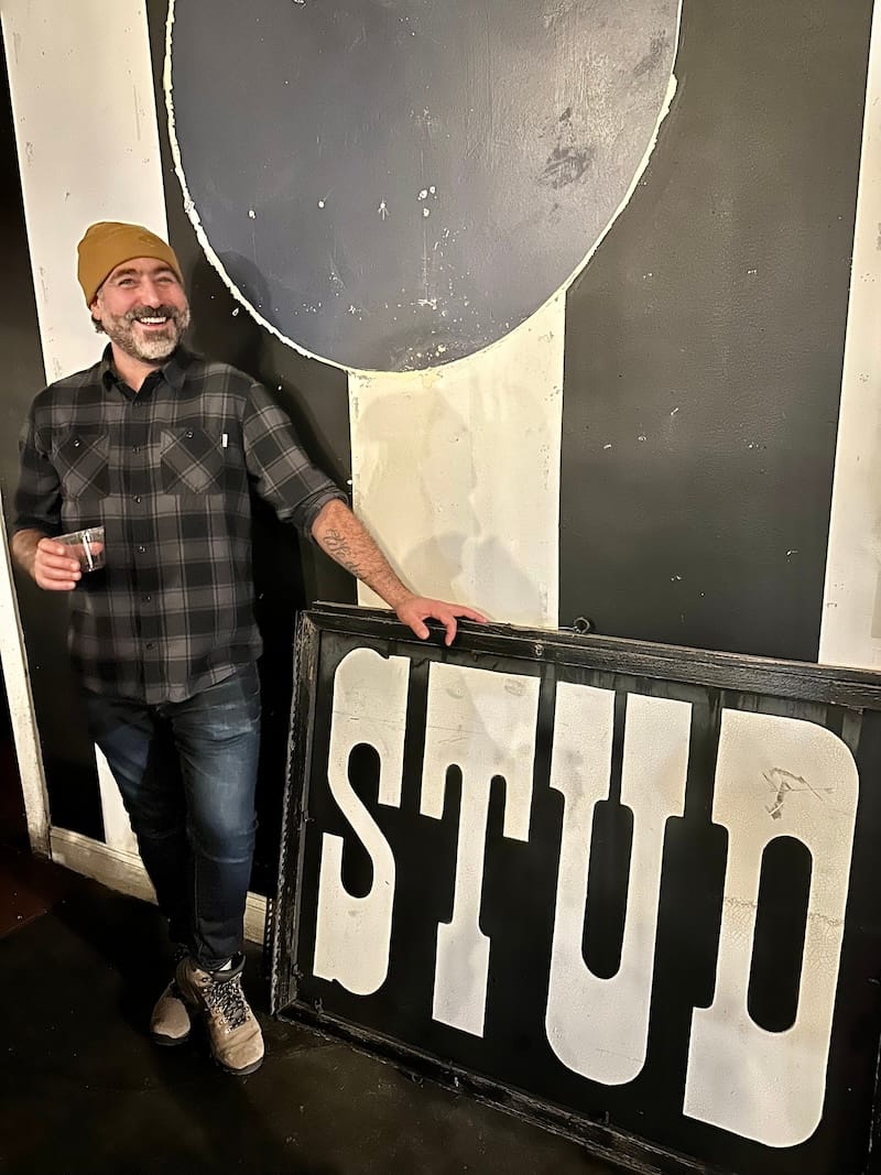 Co-owner Marke Bieschke with one of the original Stud signs. Photo: © tablehopper.com.