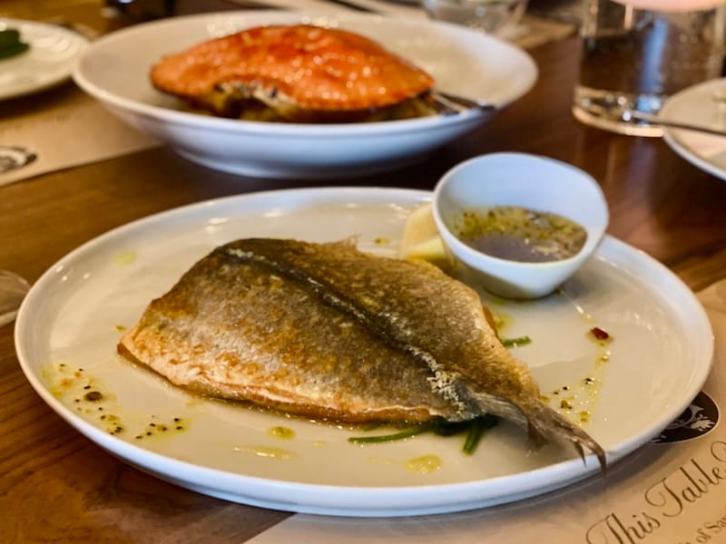 The crispy whole branzino with turmeric, lemongrass, and garlic lemon sauce. Photo by Olivia Casellini for © tablehopper.