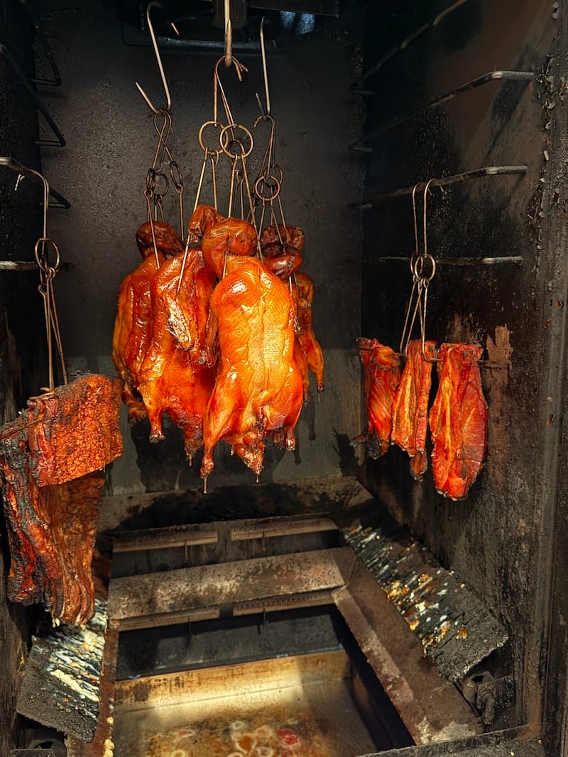 Roasted duck and pork at Quack House (with drippings destined for great things). Photo: © tablehopper.com.