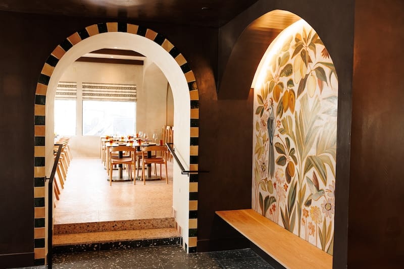 A hacienda-styled archway and hand-painted mural. Photo: Isabel Baer, Postcard Communications.