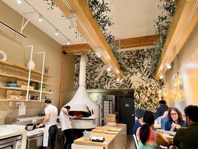 The open kitchen and three in-demand tables at Sforno. Photo: © tablehopper.com.